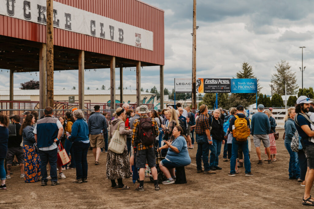 Group of homesteaders in an arena visiting